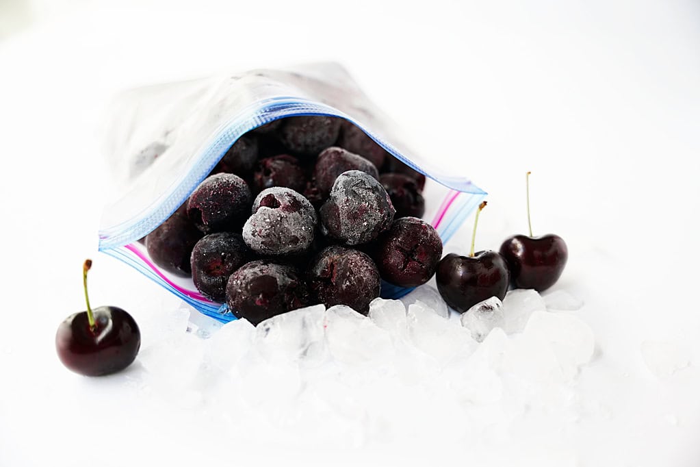 frlozen cherries in bag with ice