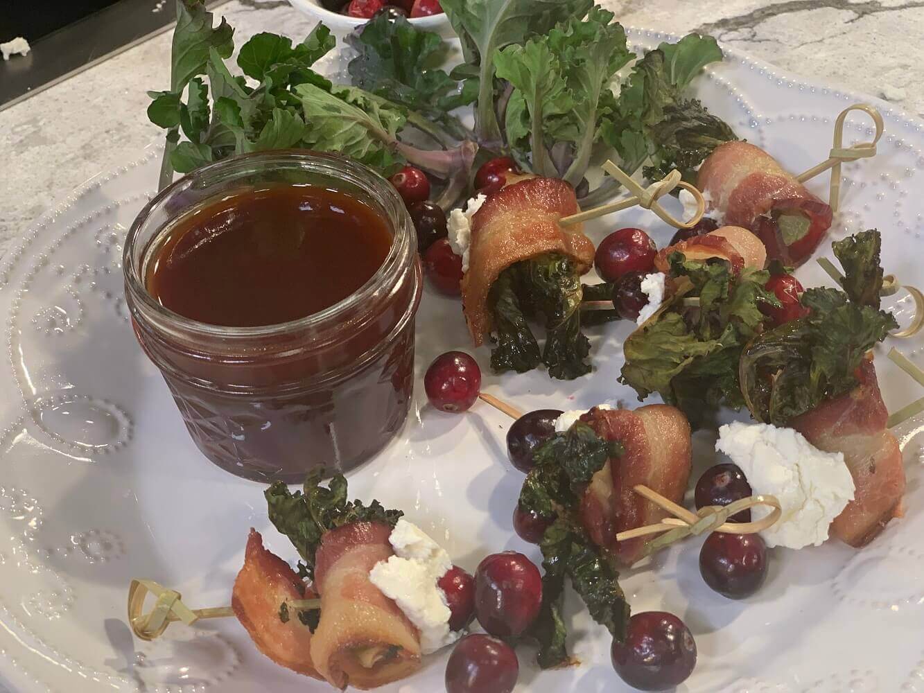 Bacon-Wrapped Kale Sprouts with Goat Cheese and Cranberries Bacon-Wrapped Kale Sprouts with Goat Cheese and Cranberries