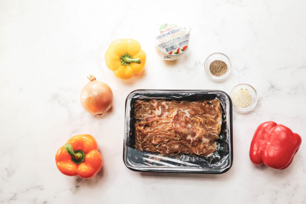 ingredients for keto stuffed peppers philly cheese steaks peppers, mozzarella, onion, shaved steak, garlic salt and pepper