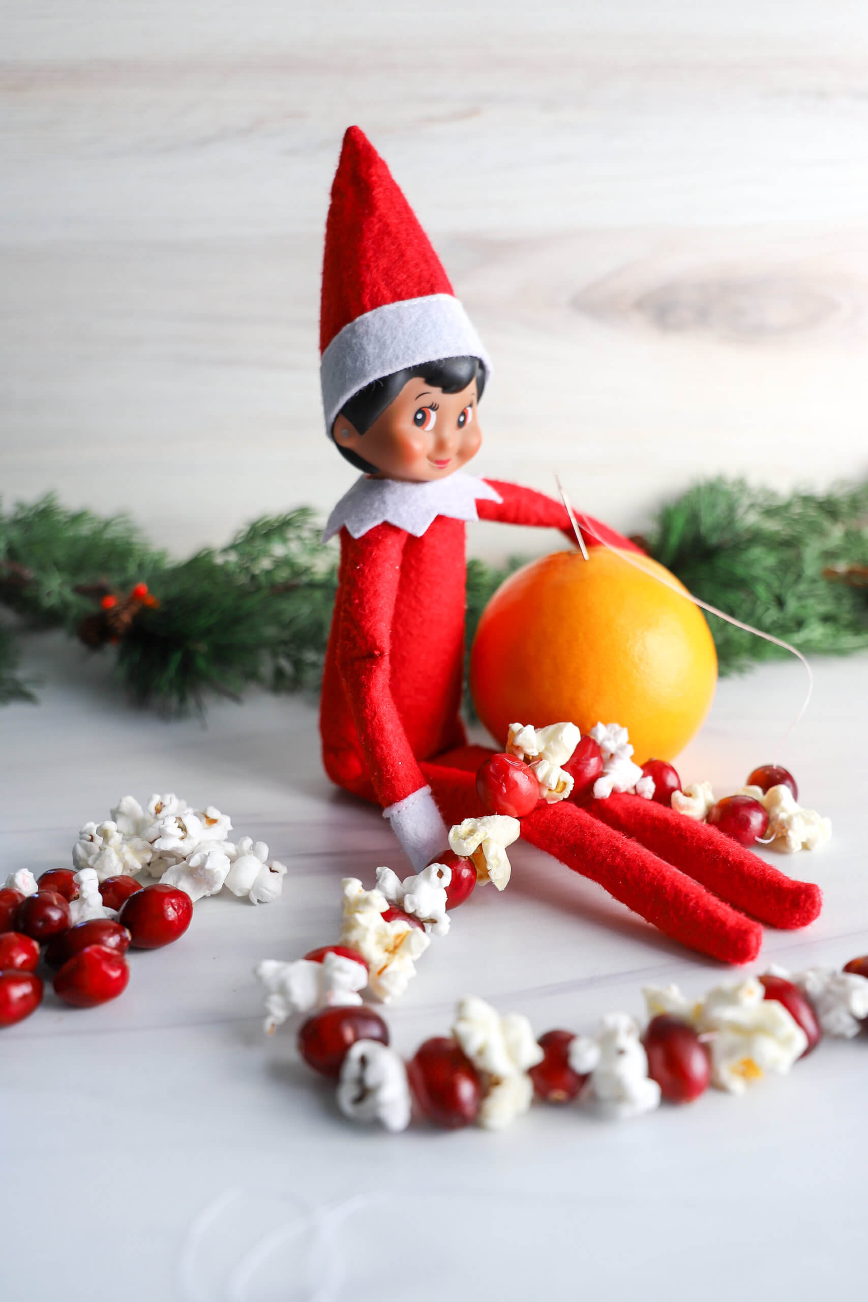 Easy Elf on the Shelf Ideas: Stringing Garland Easy Elf on the Shelf Ideas: Stringing Garland