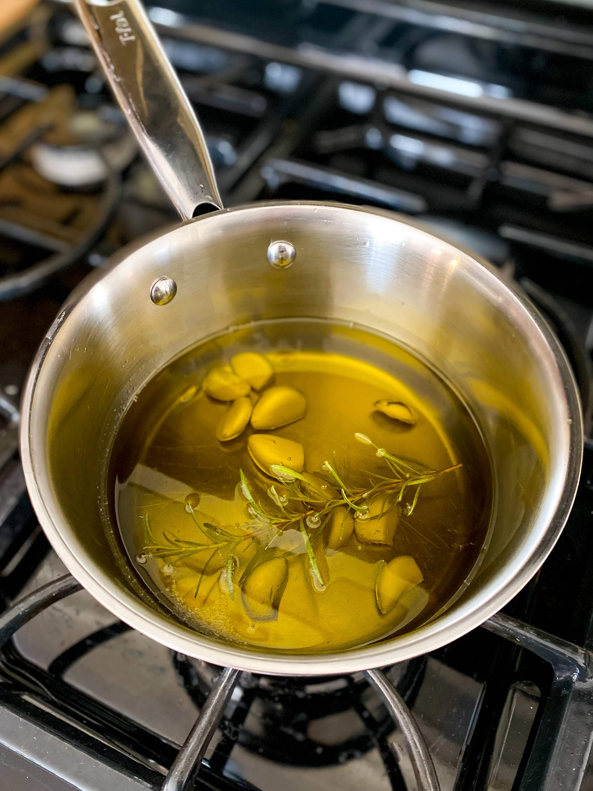Garlic and Rosemary Infused Olive Oil Making Garlic and Rosemary Infused Olive Oil