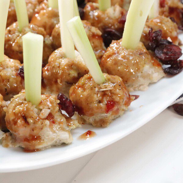 Turkey meatballs on plate with celery sticks