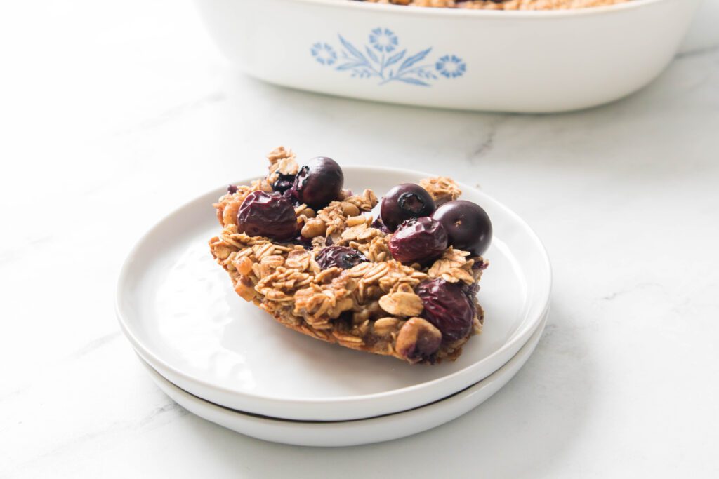 Blueberry Baked Oatmeal Blueberry Baked Oatmeal on a white plate