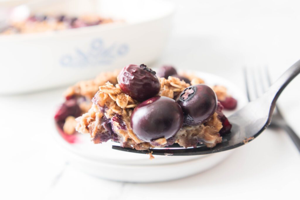 Blueberry Baked Oatmeal Blueberry Baked Oatmeal on a white plate