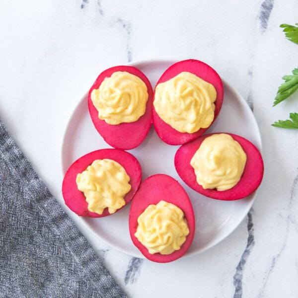 Overhead view of dyed boiled eggs using beet juice