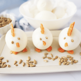 Plate of 3 hard Boiled chicks on plate with sunflower seeds
