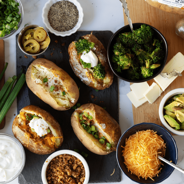 Baked Potatoes with Toppings around it