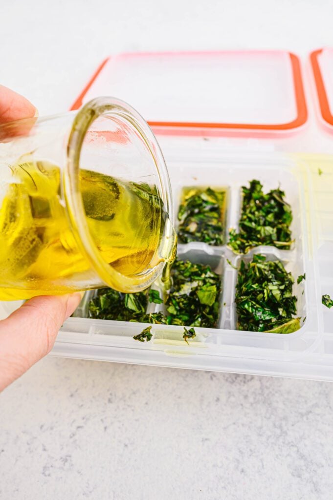 pouring oil in ice cube trays