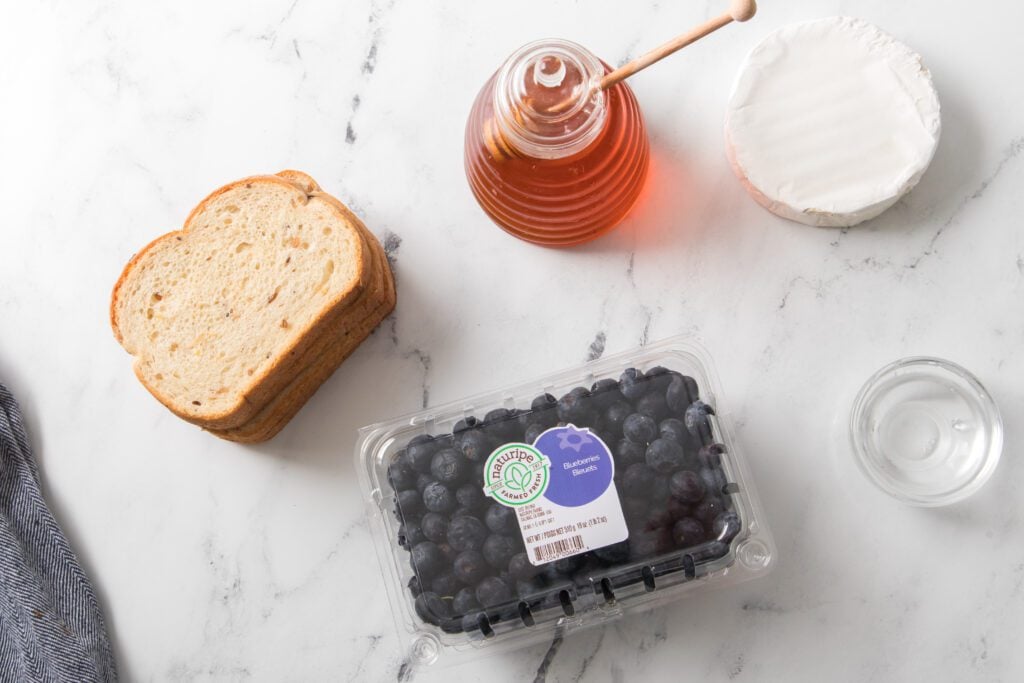 ingredients: wheat bread, Naturipe blueberries, brie cheese wheel, honey, water