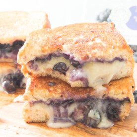 bite taken out of blueberry grilled cheese sandwich