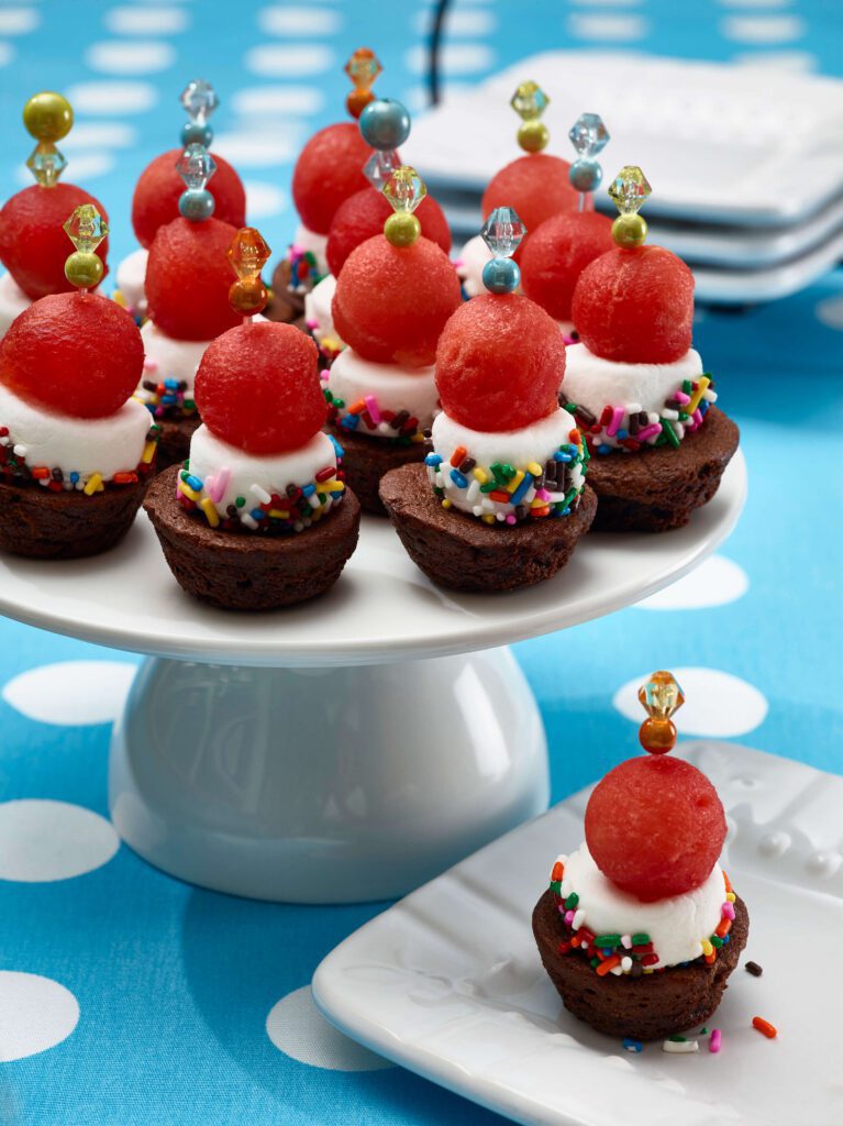 watermelon brownie bites on a cake platter