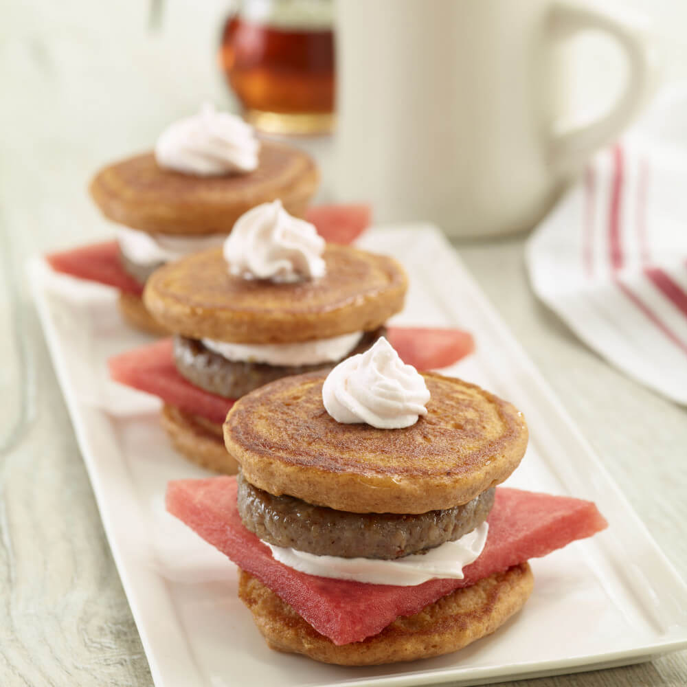 Plate of watermelon sausage pancake sandwiches
