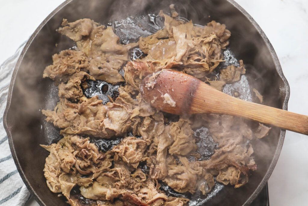 shaved steak in skillet