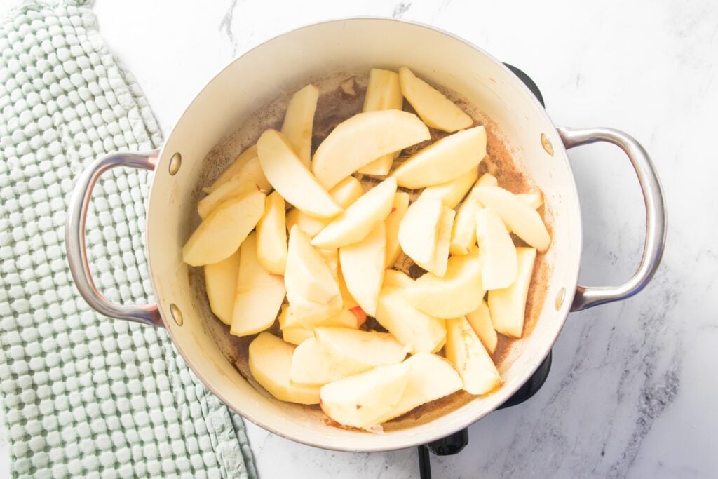 apples added to saucepan