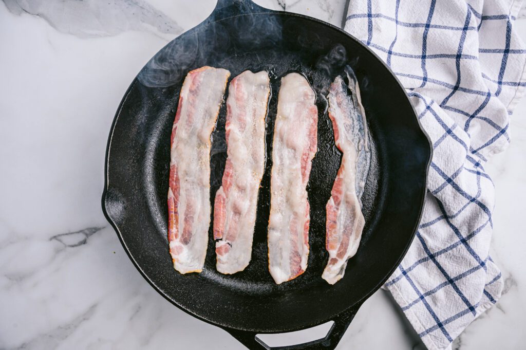 Cook bacon over medium-high heat for 5-6 minutes, or until crispy. Then set aside on a paper towel-lined plate.