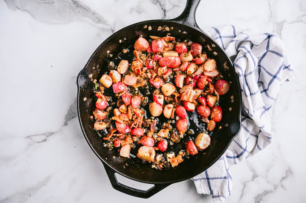 Add garlic, thyme, salt, and pepper and cook, stirring constantly, for about 1 minute.
