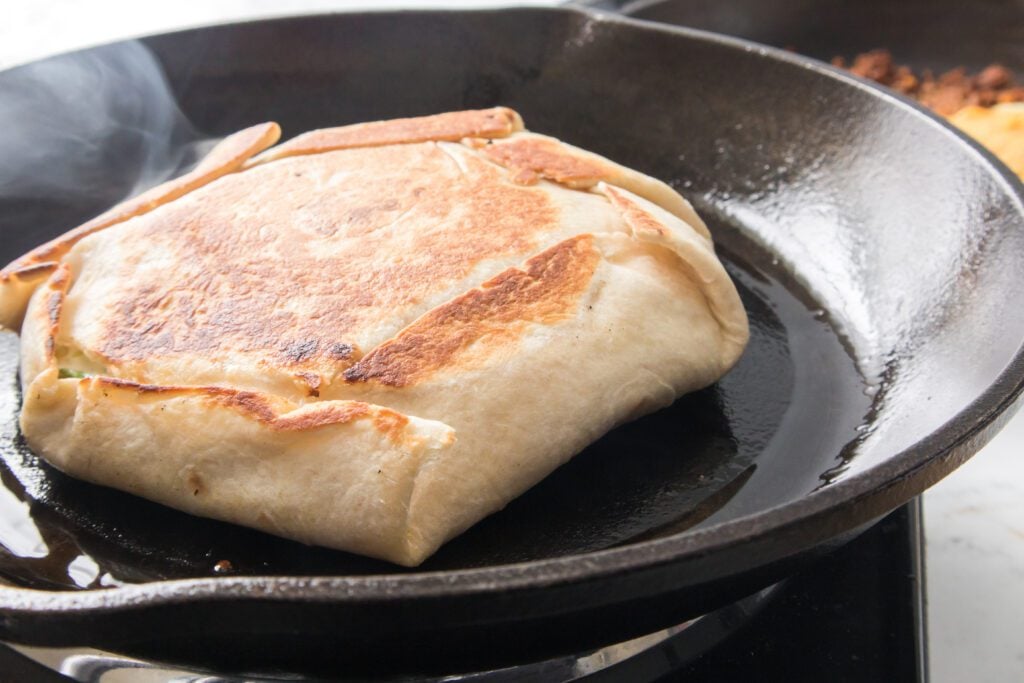crunchwrap in a cast iron skillet