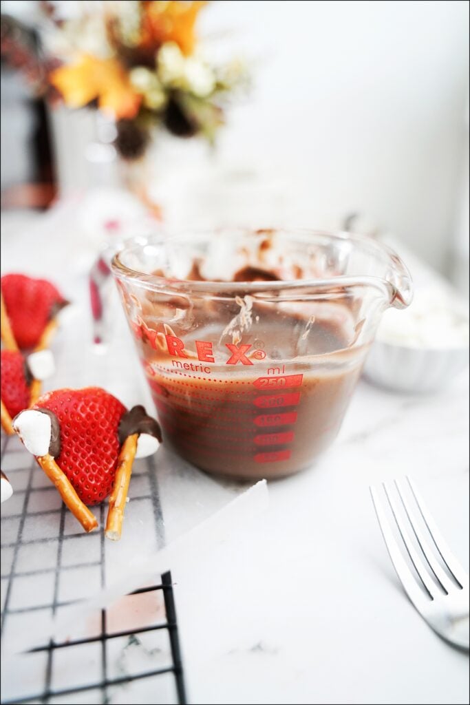 measuring cup with melted chocolate