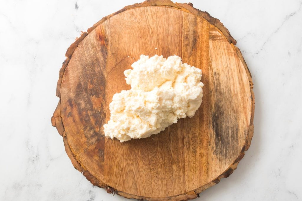 round serving board with ricotta