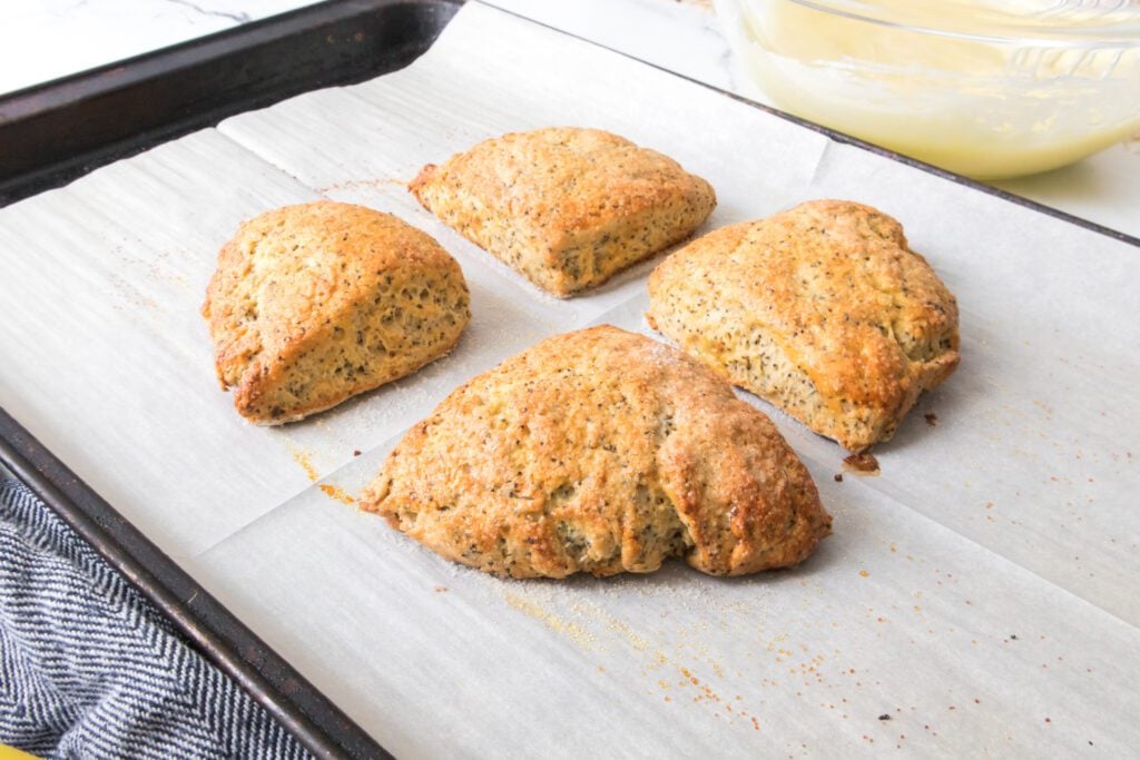 lemon scones after baking on a baking sheet with parchment paper