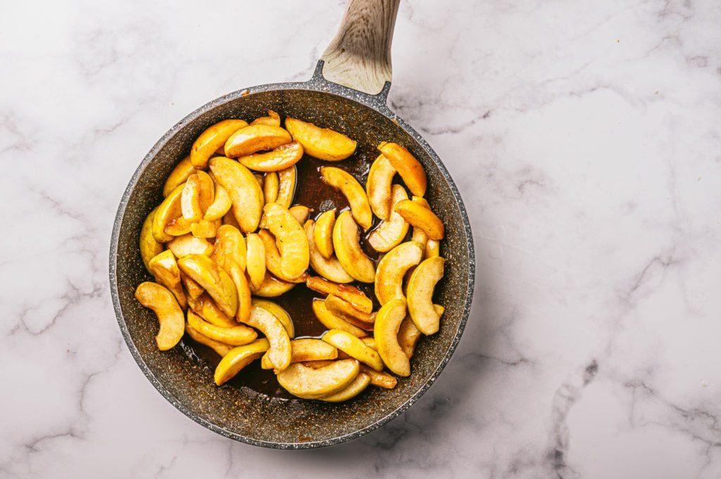 sliced apples in saucepan