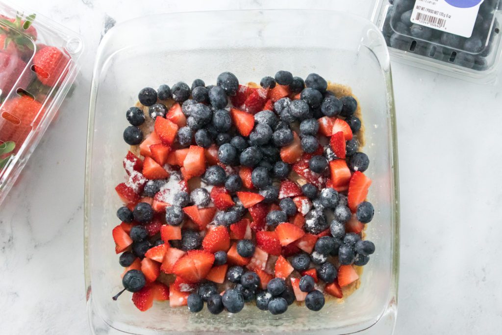 bluberries and strawberries dusted with cornstarch and sugar