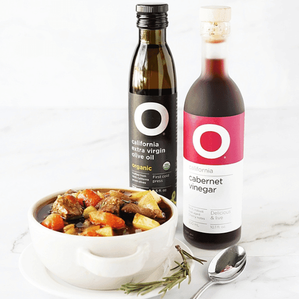 Beef Stew in dish with O Olive Oil Bottles