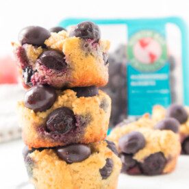 Three Keto Blueberry Muffins stacked on top of each other