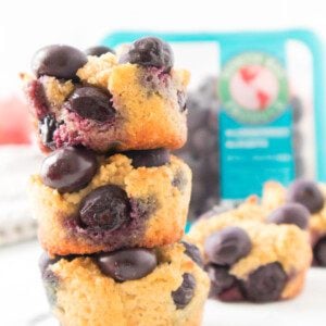 Three Keto Blueberry Muffins stacked on top of each other