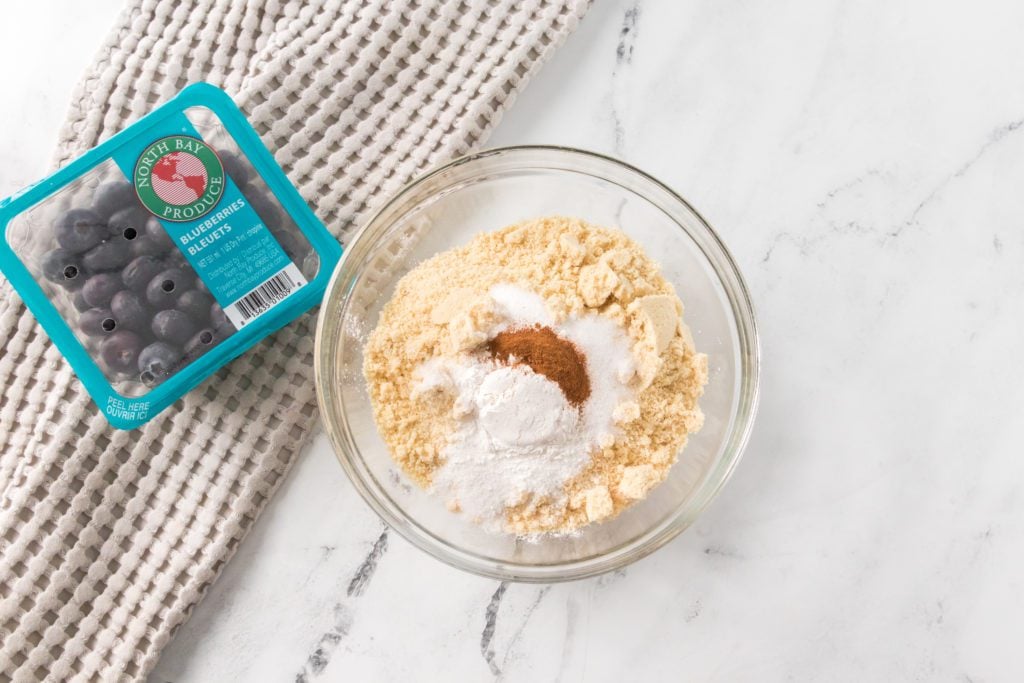 dry ingredients in glass bowl for keto blueberry muffins