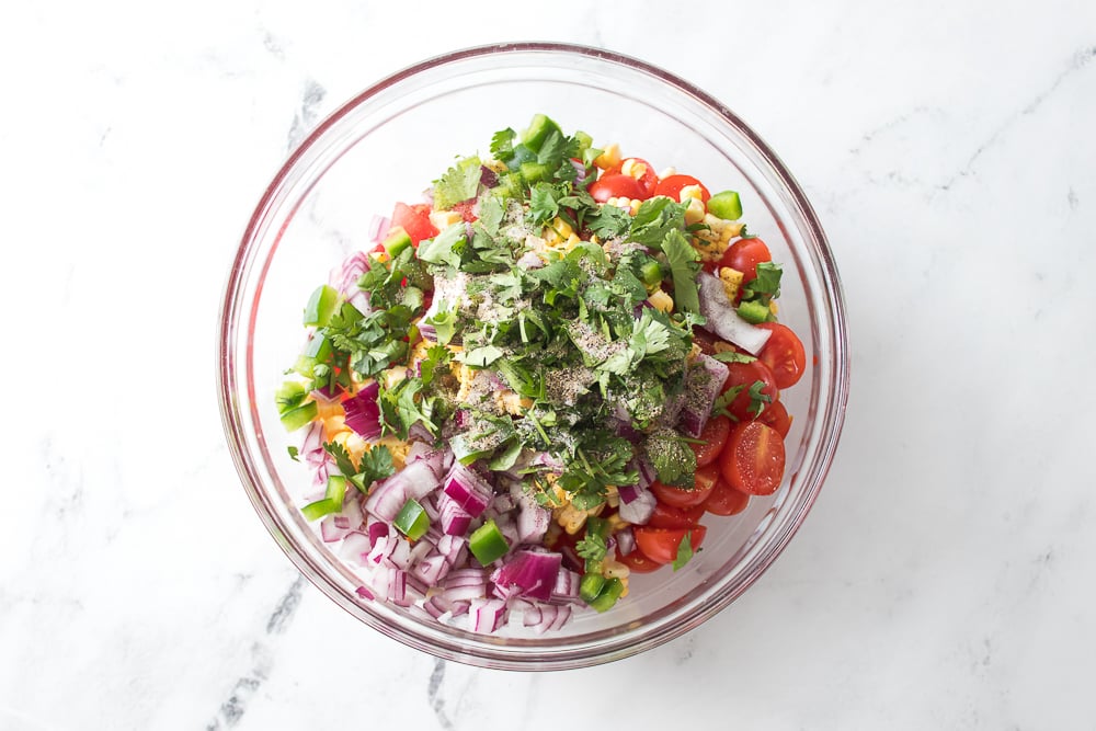 Large bowl with ingredients being dumped in