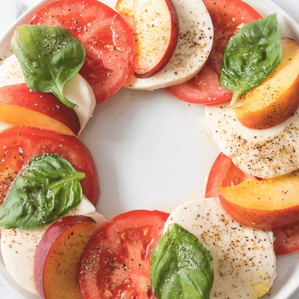 Ovearhead view of Peach Caprese on white plate