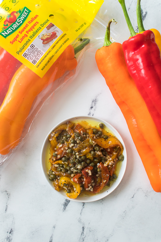 overhead shot of Italian sweet peppers on plate with olive oil