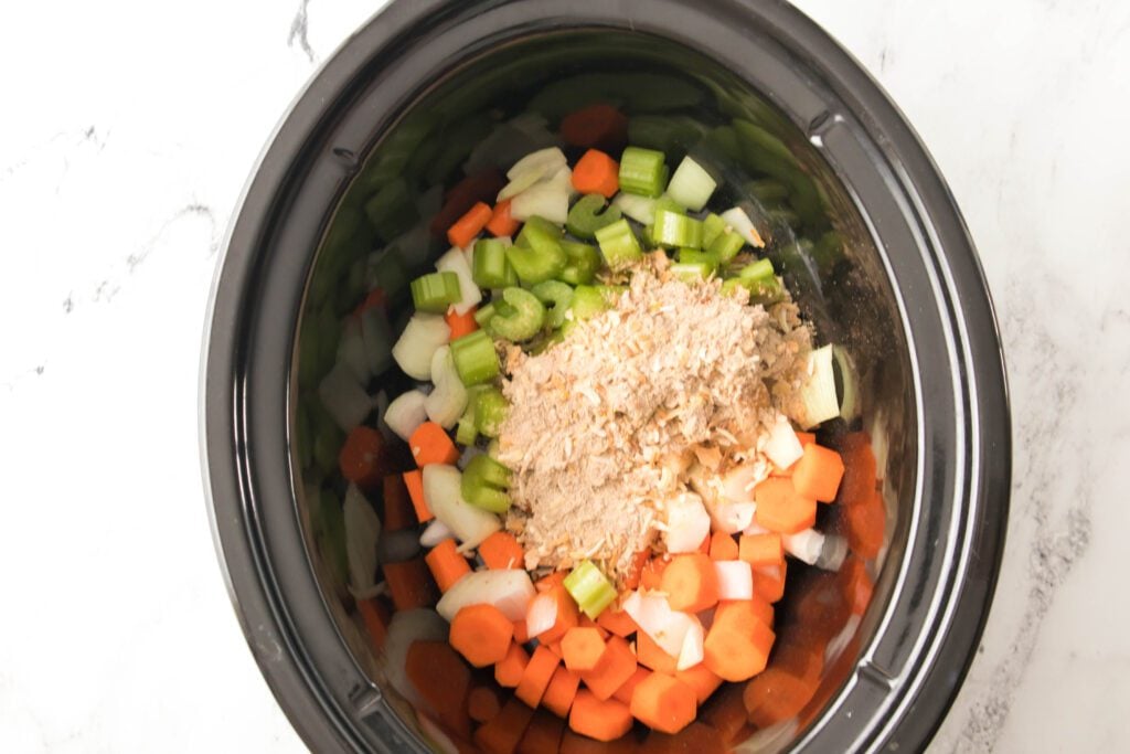 carrots, celery and onions with onion soup mix in slow cooker