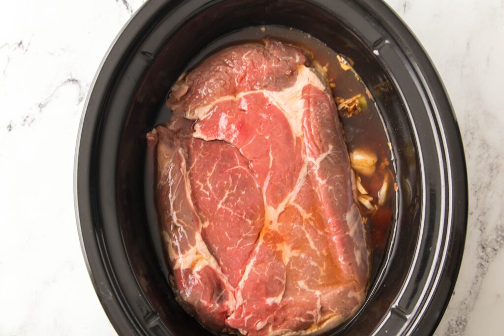 veggies and roast in slow cooker with beef broth and beer