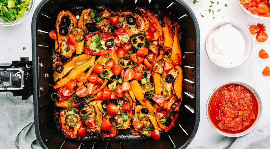 Overhead view of mini bell pepper nachos in air fryer basket