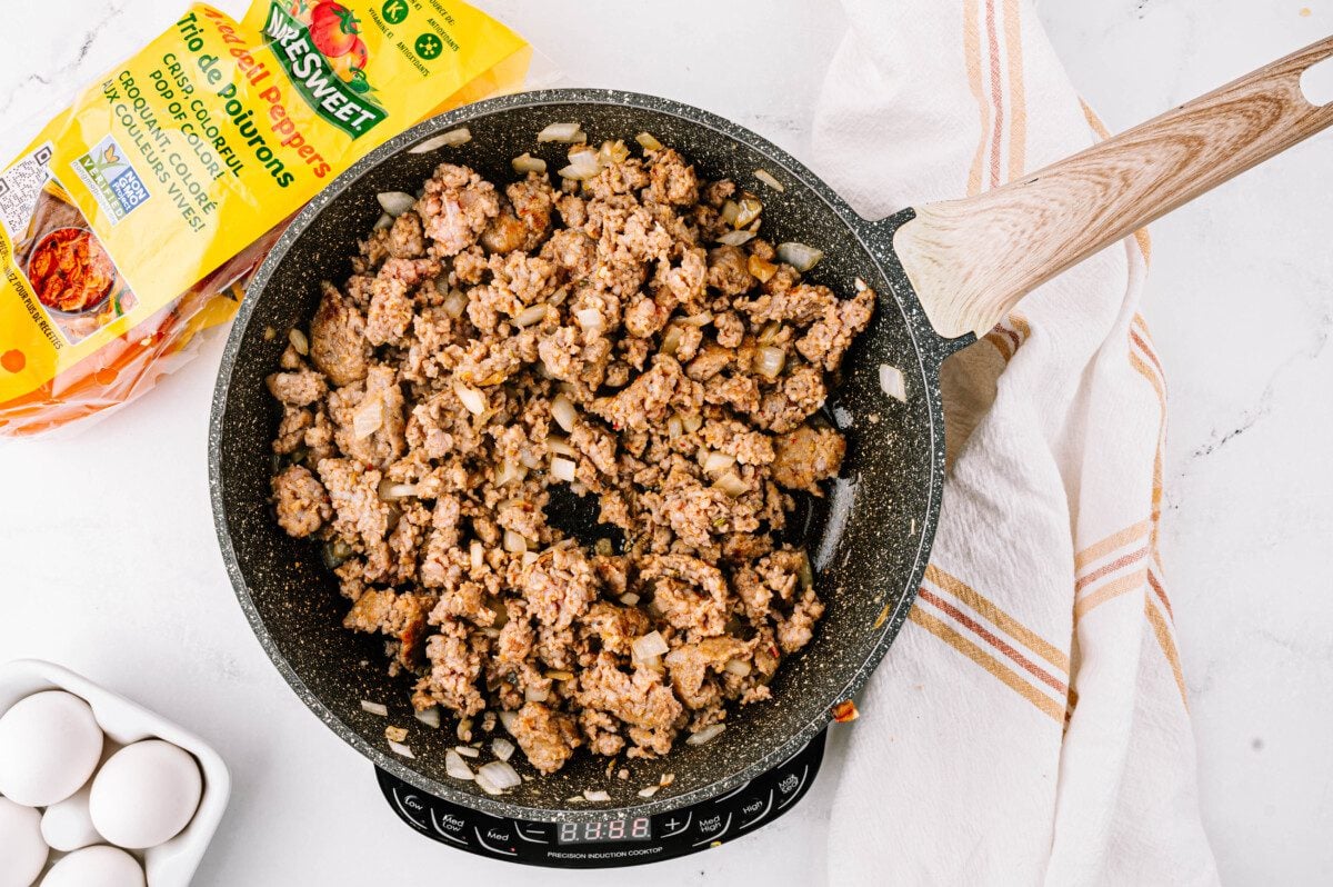 Cook sausage until browned.