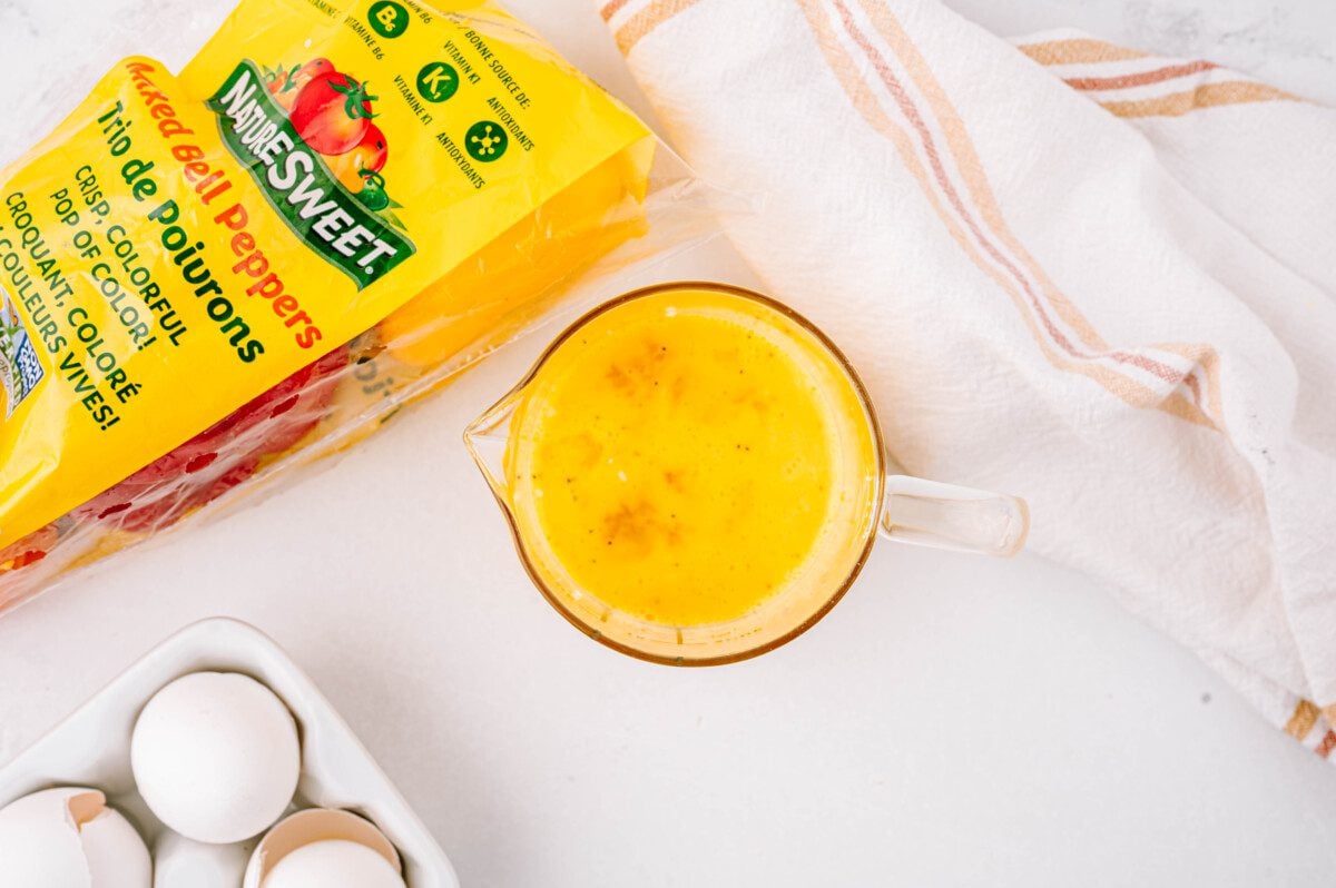 Whisk together eggs, salt, and pepper. Then mix in 1/2 cup of cheese.