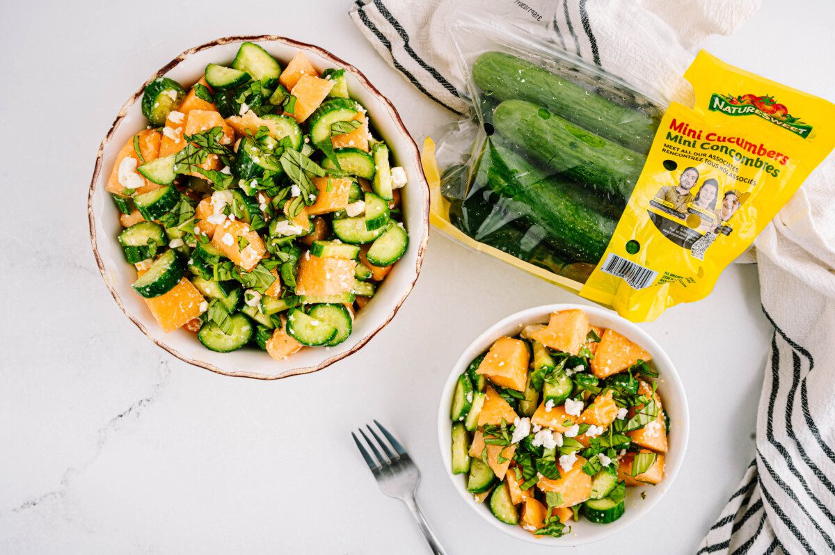 Cantaloupe cucumber salad topped with feta and basil