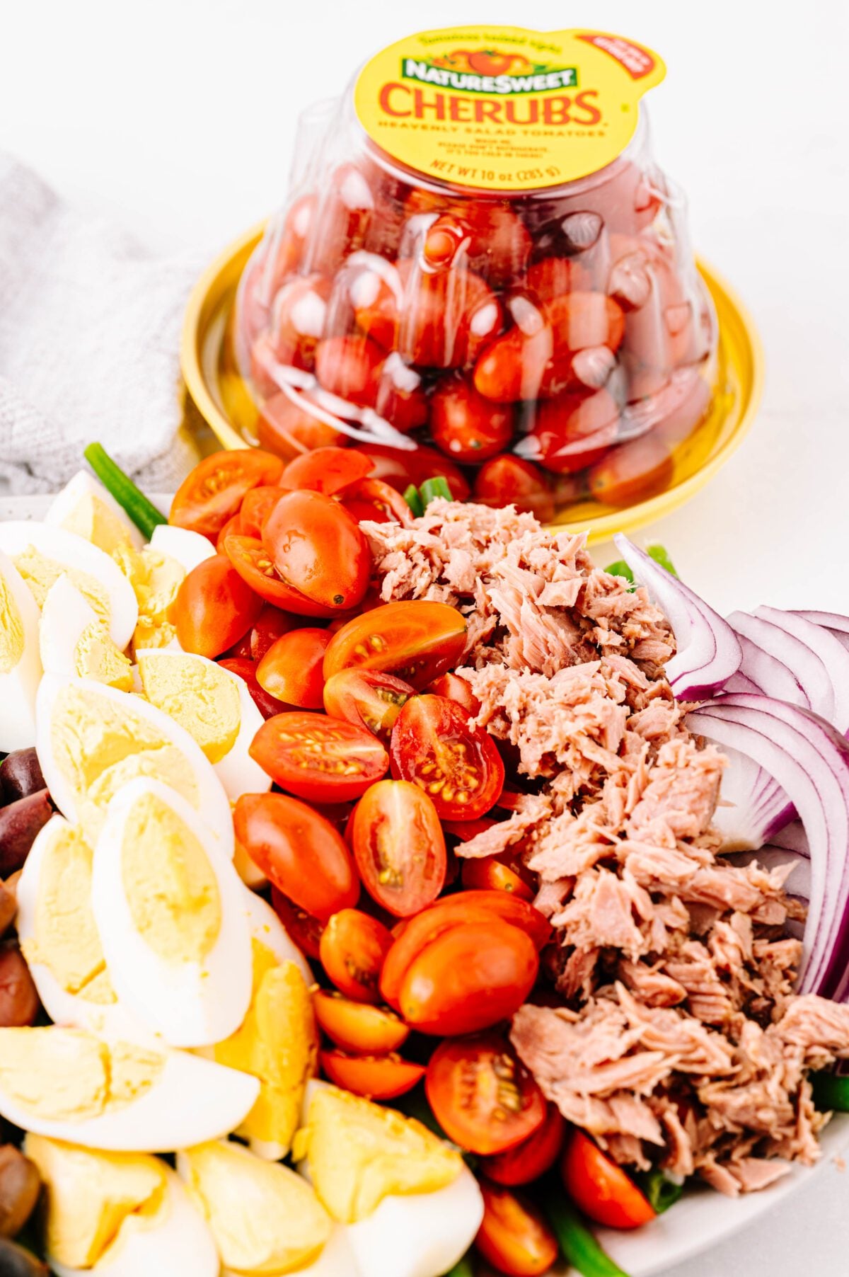 zoomed in view of Nicoise salad with Cherubs® in background