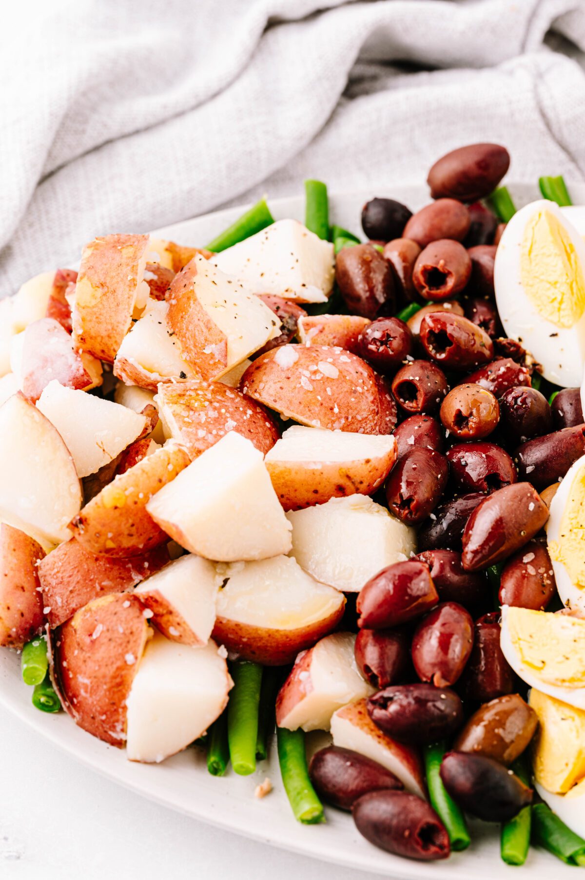 Zoomed in view of veggies in Nicoise Salad