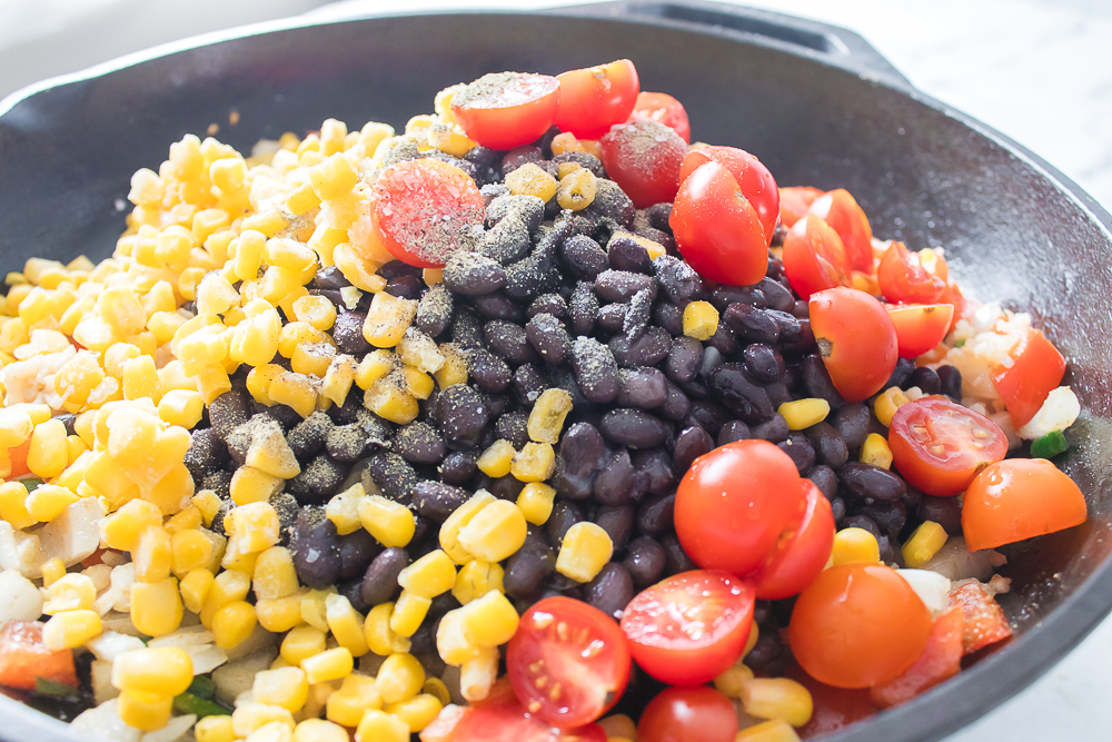 Brown rice, corn, Bare Beans Black Beans, diced tomatoes and salt added to the pan