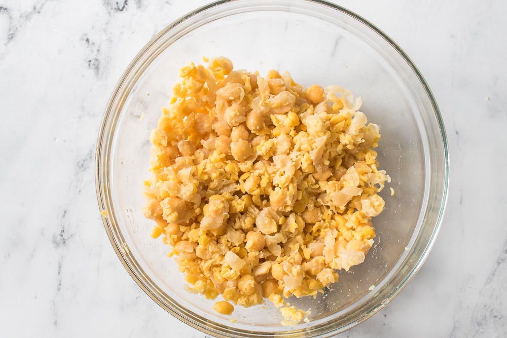 chickpeas smashed in glass bowl