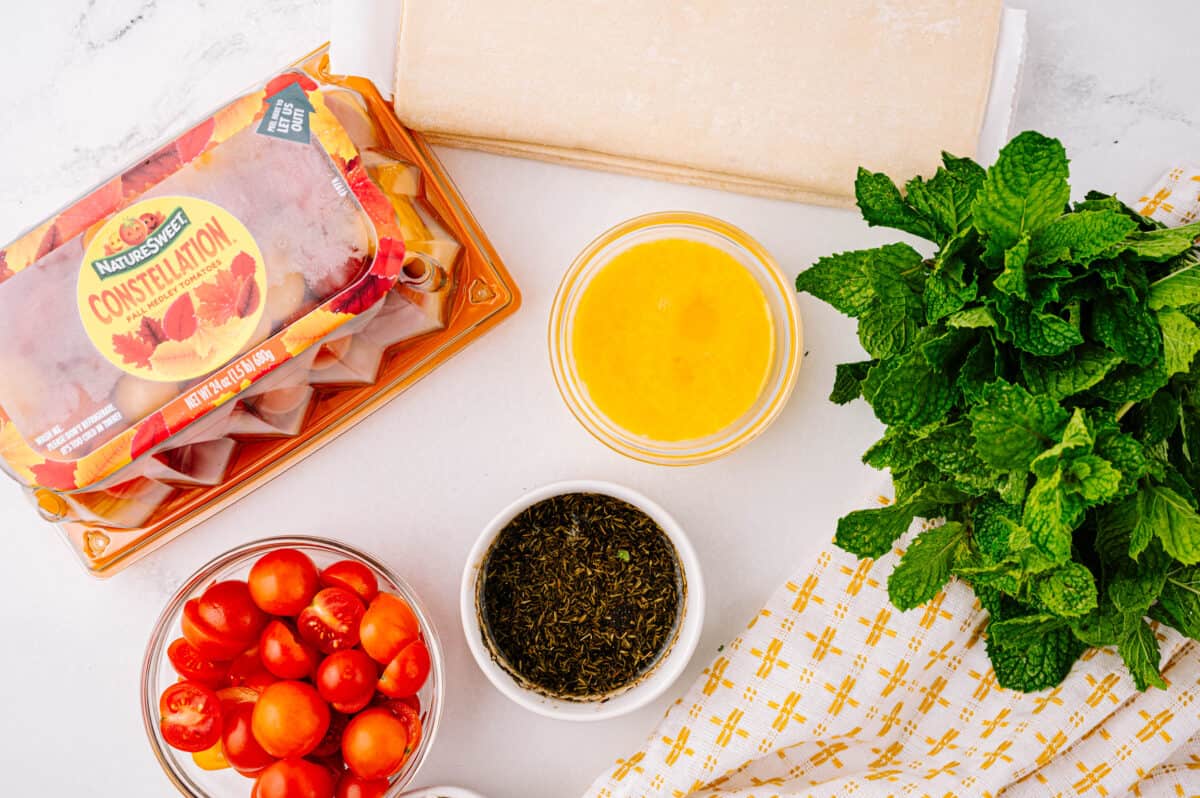 overhead shot of ingredients needed for making tomato tartlets at home