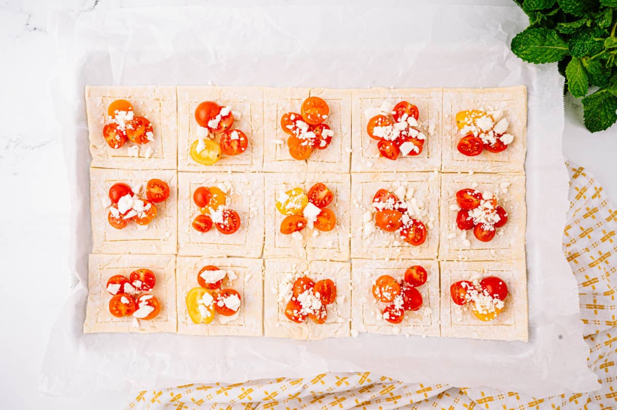 puff pastry cut with tomatoes and feta cheese