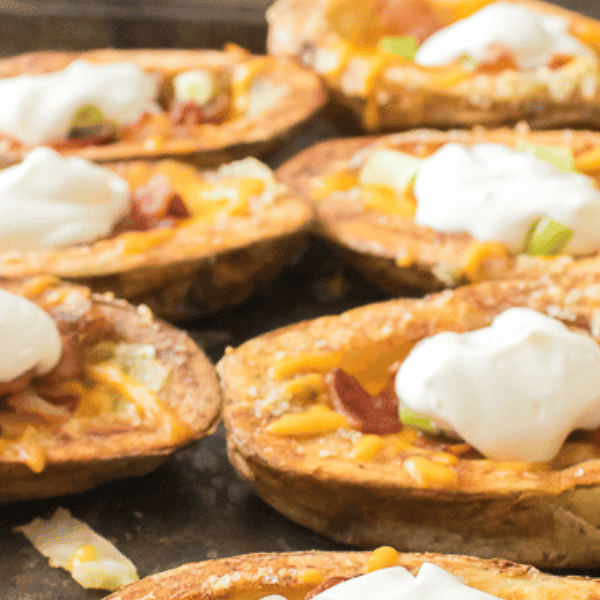 Loaded potato skins on baking sheet