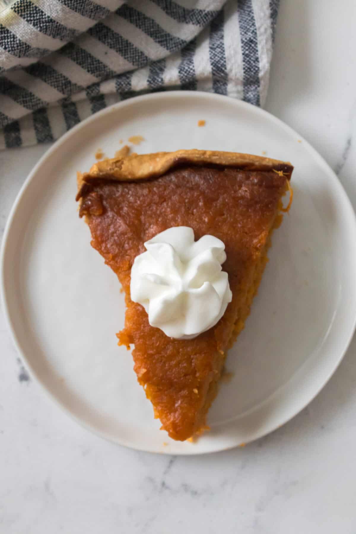 overhead shot of sweet potato pie with reddi whip