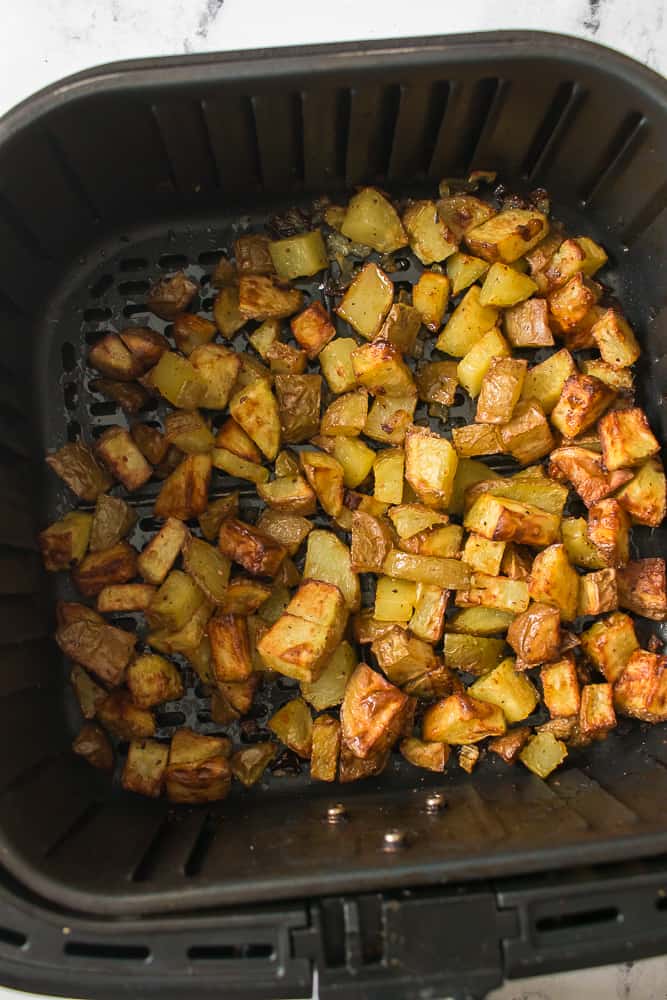 overhead shot of roasted potatoes in the air fryer basket