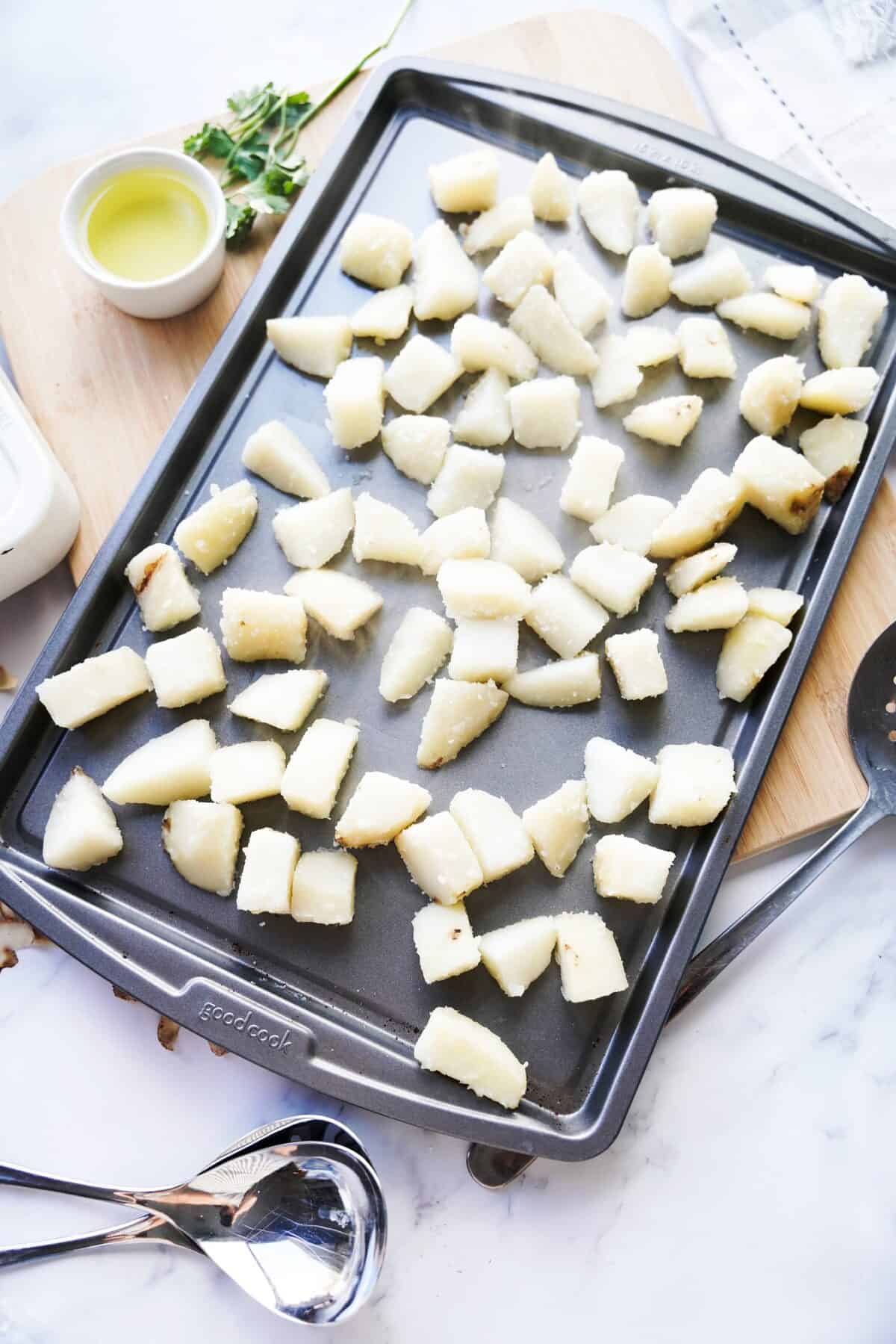 potatoes on baking sheet after par-boiling