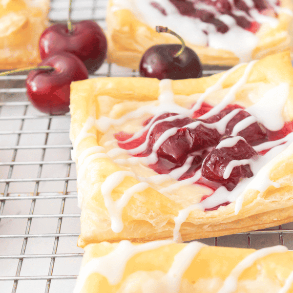 Cherry danishes on a wire rack